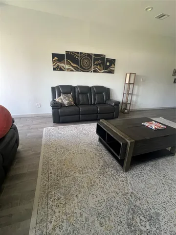 a bedroom with a bed and parked