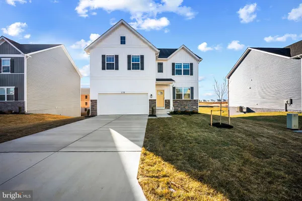 a view of a back yard of the house