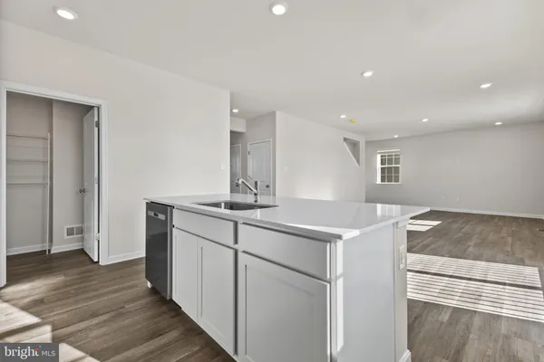 a kitchen with a sink and cabinets