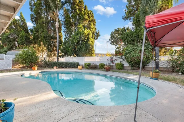 a view of a swimming pool with a patio