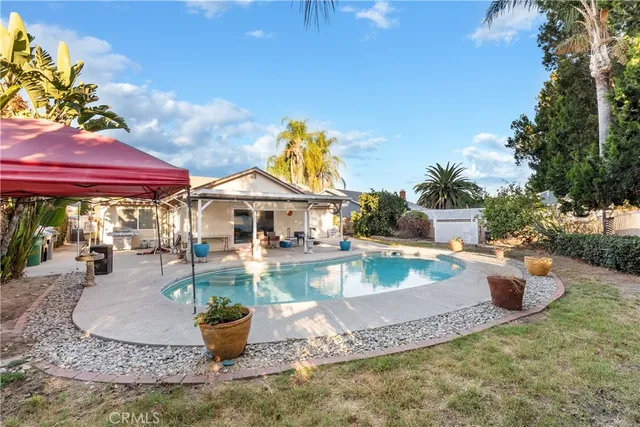 a view of a swimming pool with sitting area