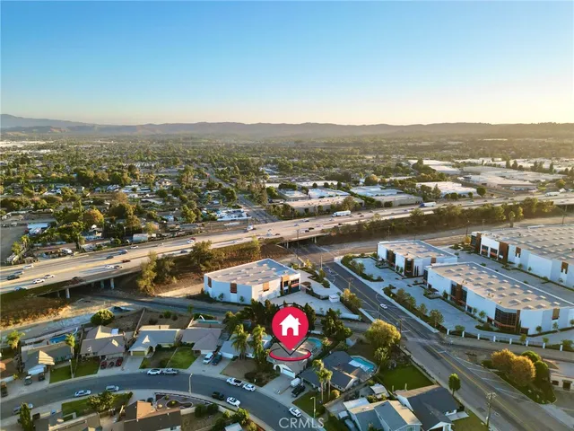 an aerial view of residential building and lake