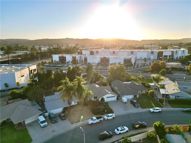 an aerial view of residential houses with outdoor space