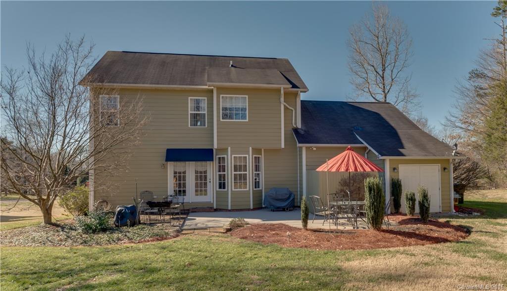 110 Bechtler Court Rutherfordton, NC 28139 - Photo 2 of 24 a backyard of a house with fire pit and chairs