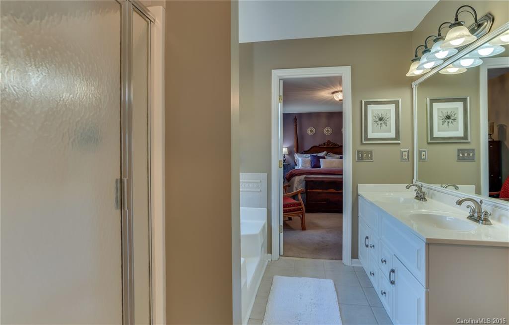 110 Bechtler Court Rutherfordton, NC 28139 - Photo 19 of 24 a en suite bathroom with a double vanity sink and a mirror
