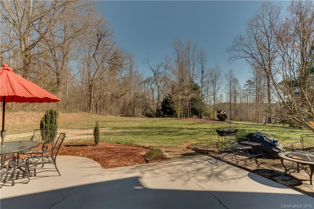 110 Bechtler Court Rutherfordton, NC 28139 - Photo 3 of 24 a backyard of a house with trees and outdoor seating