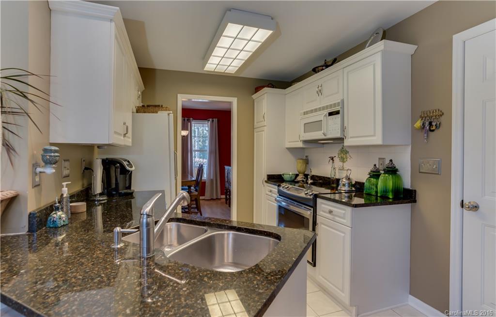 110 Bechtler Court Rutherfordton, NC 28139 - Photo 7 of 24 a kitchen with stainless steel appliances granite countertop a sink stove and refrigerator
