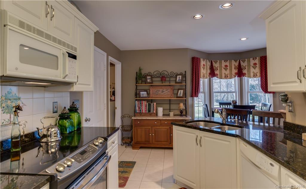 110 Bechtler Court Rutherfordton, NC 28139 - Photo 9 of 24 a kitchen with stainless steel appliances a stove top oven a sink a counter space and a window