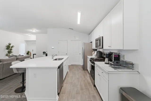 a bedroom with a bed and a mirror