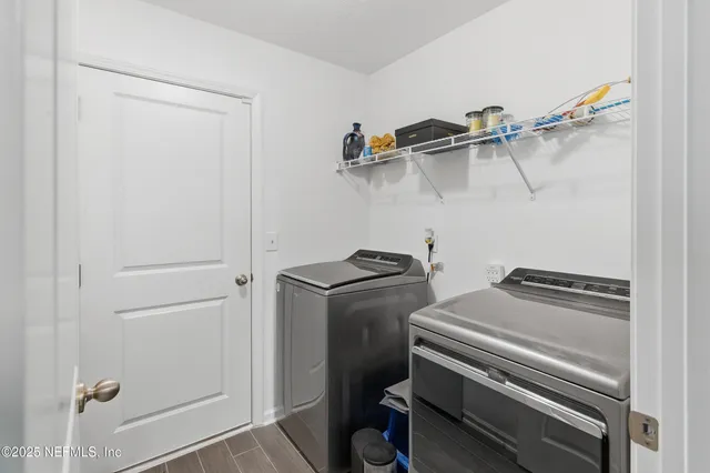 a view of swimming pool with a table and chairs