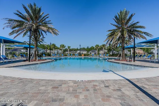 a front view of house with a garden and patio