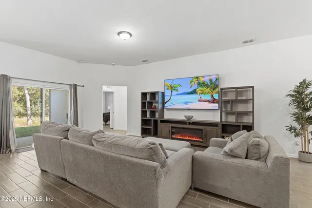a kitchen with white cabinets appliances and sink
