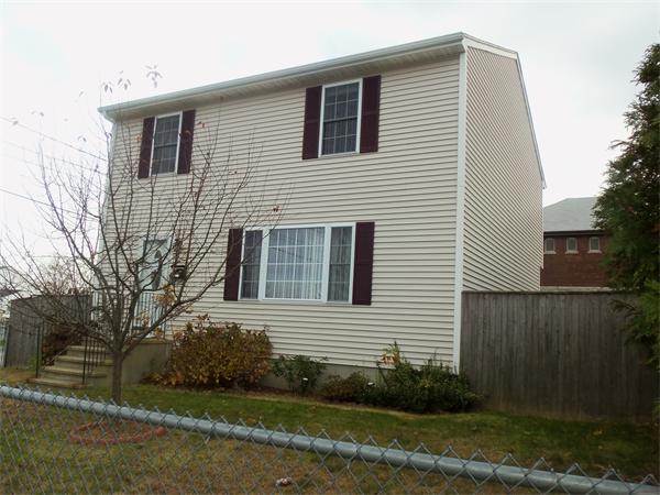 85 Baird Street Fall River, MA 02721 - Photo 1 of 8 a view of a house with yard and a garden