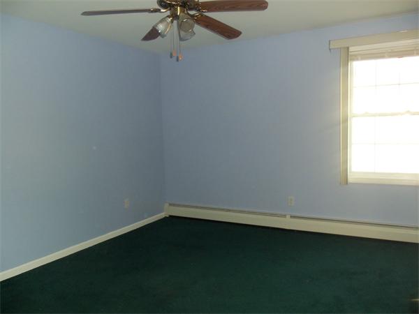 85 Baird Street Fall River, MA 02721 - Photo 5 of 8 an empty room with a window