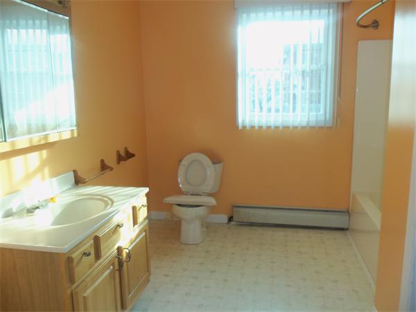 85 Baird Street Fall River, MA 02721 - Photo 6 of 8 a bathroom with a sink and a toilet