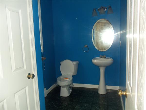 85 Baird Street Fall River, MA 02721 - Photo 7 of 8 a bathroom with a toilet sink and mirror