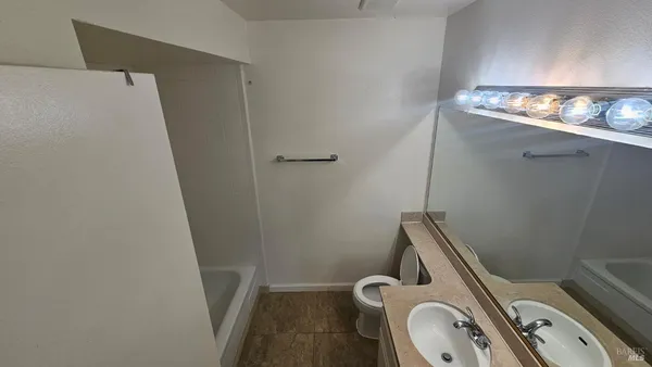 a bathroom with a sink and toilet