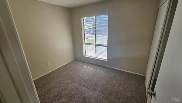 a view of empty room with windows