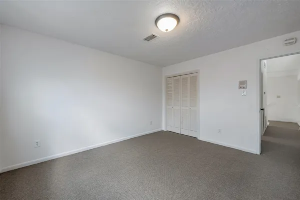an empty room with a empty space and a window