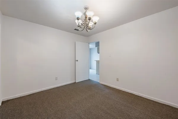 a view of a chandelier in big room
