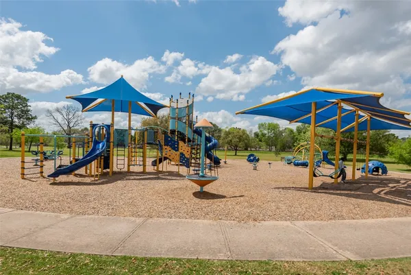 a view of a park with swings