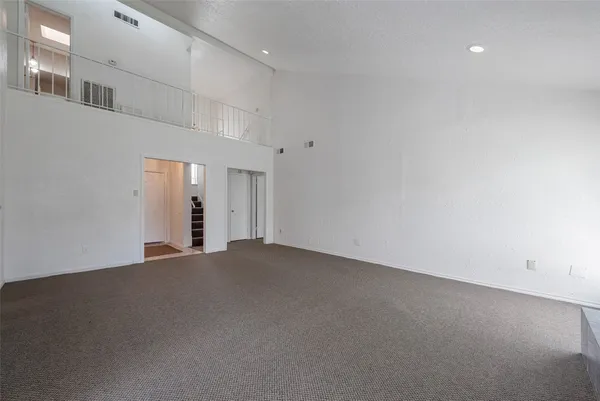 a view of an empty room with a fireplace