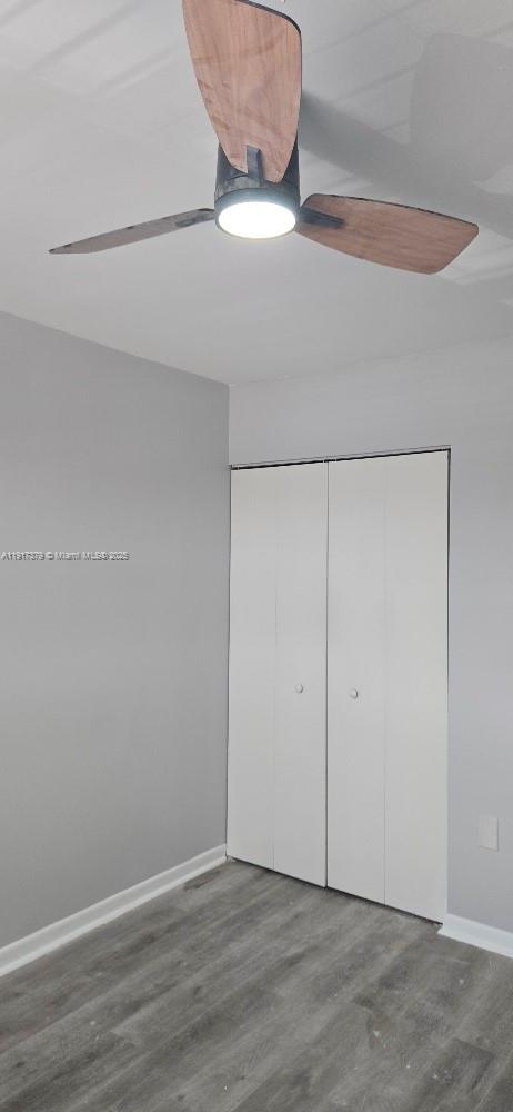 8145 Northwest 7th Street, Unit 320 Miami, FL 33126 - Photo 5 of 9 an empty room with wooden floor