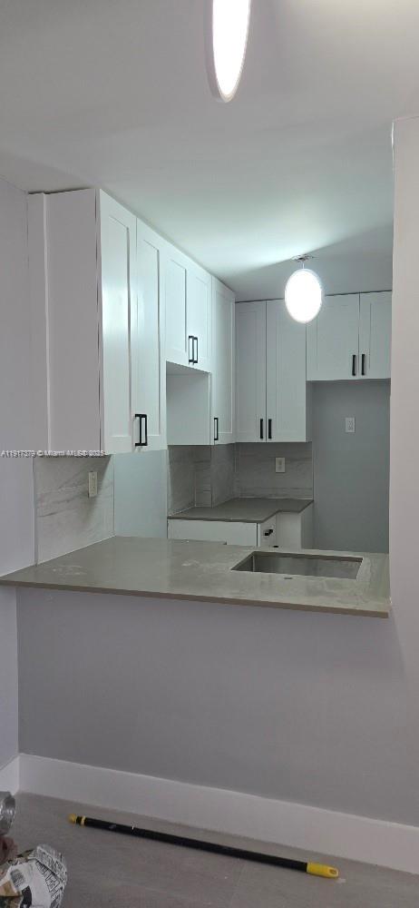 8145 Northwest 7th Street, Unit 320 Miami, FL 33126 - Photo 9 of 9 a kitchen with stainless steel appliances granite countertop a sink a stove and a refrigerator