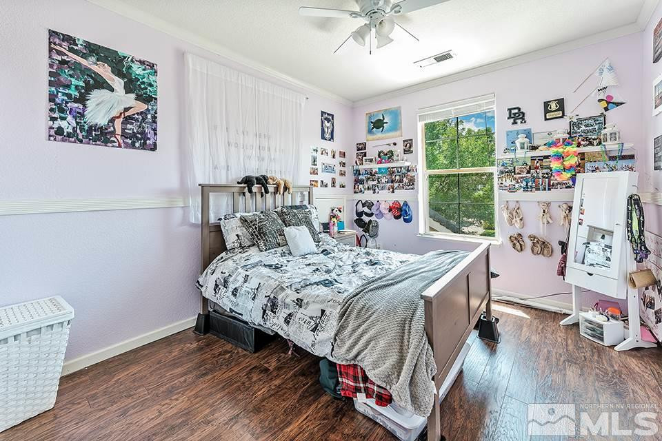 1783 Back Country Road Reno, NV 89521 - Photo 13 of 16 a bed sitting in a bedroom next to a window