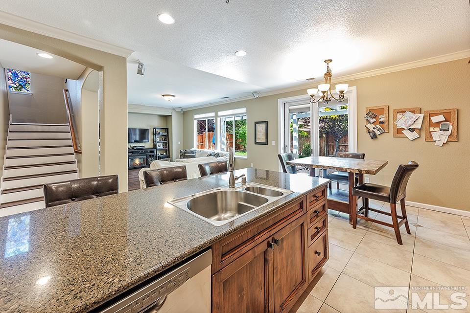 1783 Back Country Road Reno, NV 89521 - Photo 4 of 16 a kitchen with granite countertop a sink and a refrigerator