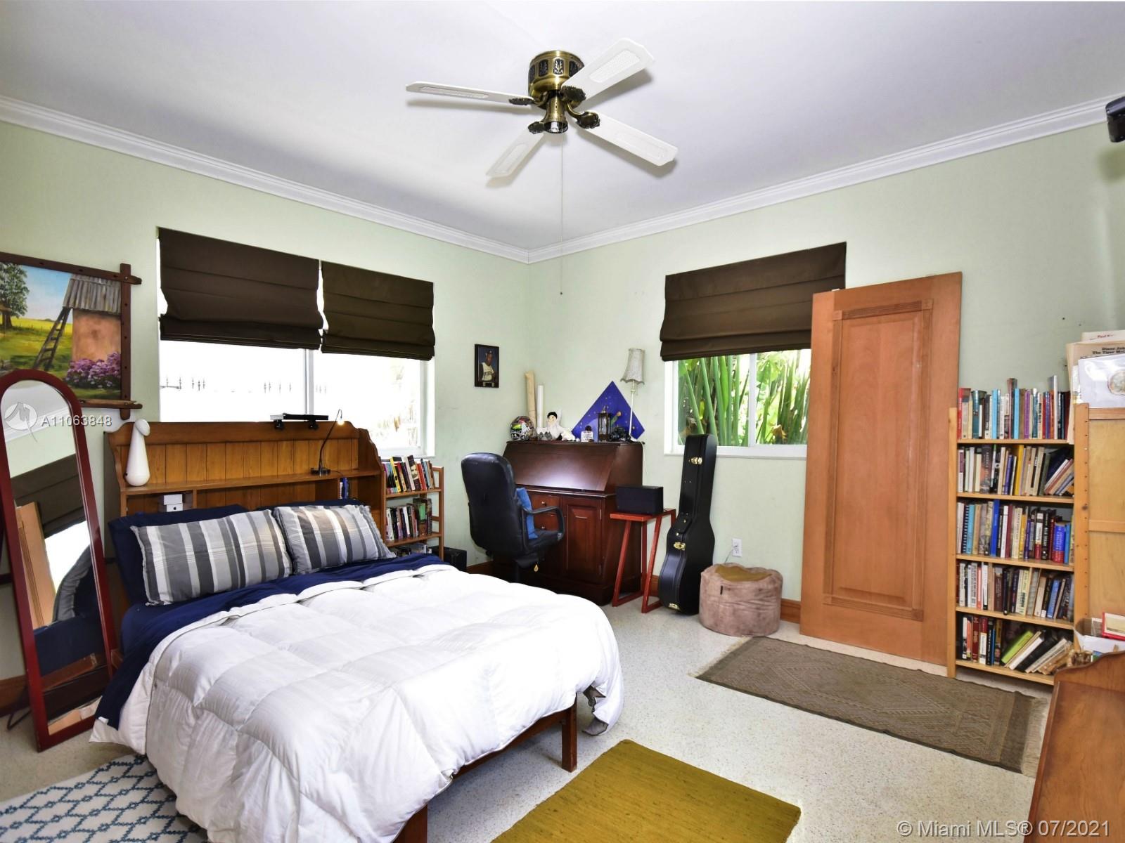 4755 Alton Road Miami Beach, FL 33140 - Photo 11 of 21 a bedroom with a bed and dresser