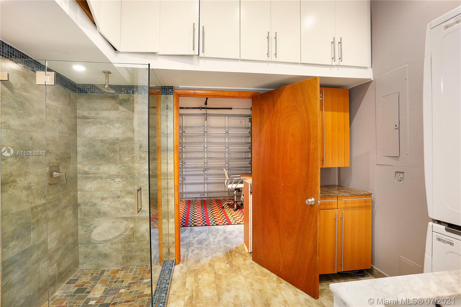 4755 Alton Road Miami Beach, FL 33140 - Photo 13 of 21 a bathroom with a tub and shower