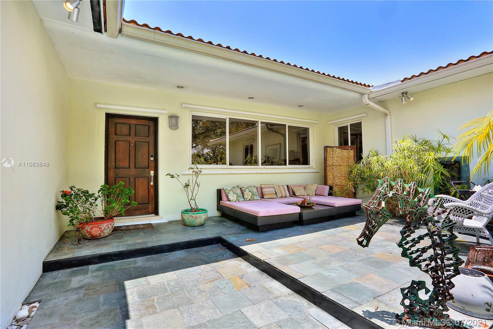 4755 Alton Road Miami Beach, FL 33140 - Photo 3 of 21 a outdoor space with patio furniture