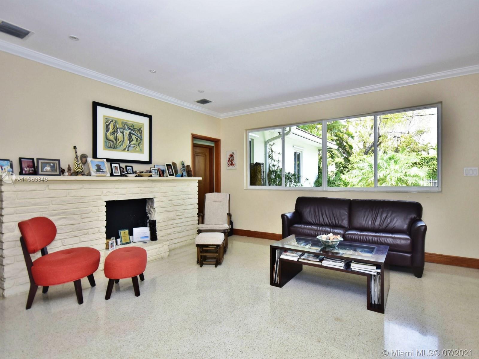 4755 Alton Road Miami Beach, FL 33140 - Photo 5 of 21 a living room with furniture fireplace and window