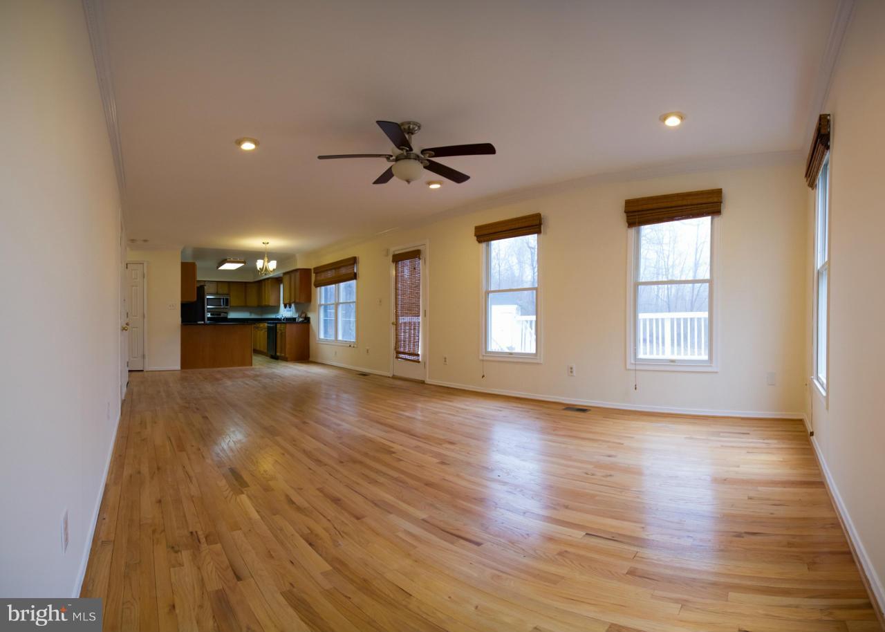14619 Good Hope Road Silver Spring, MD 20905 - Photo 8 of 23 a view of a livingroom with a kitchen and a wooden floor