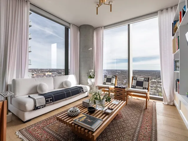 a living room with furniture and a rug
