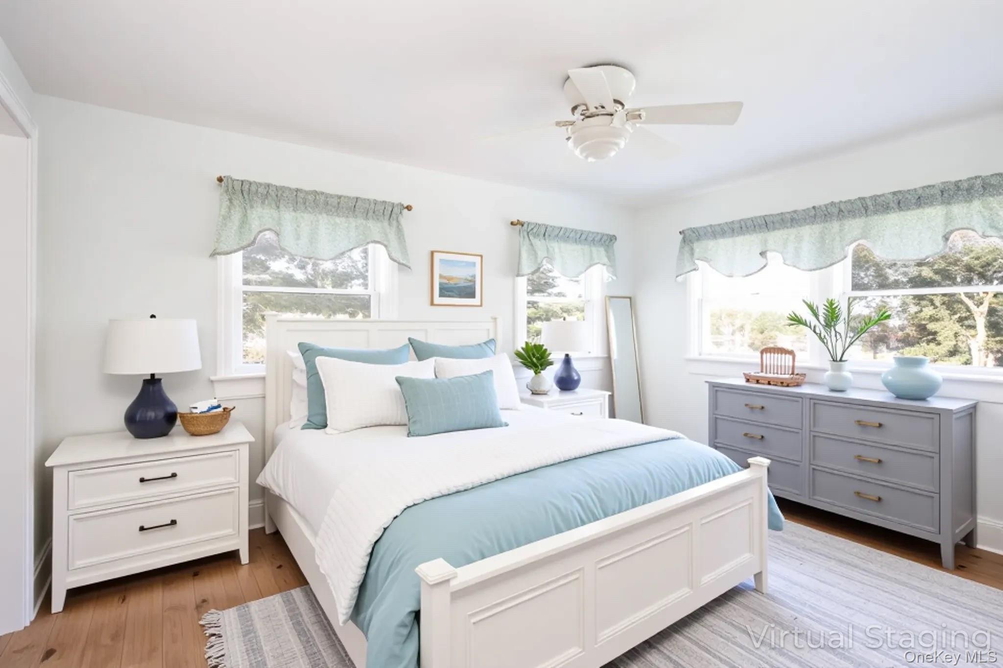 1 Canal Road Hampton Bays, NY 11946 - Photo 27 of 50 Virtually Staged Bedroom featuring light wood-type flooring and ceiling fan