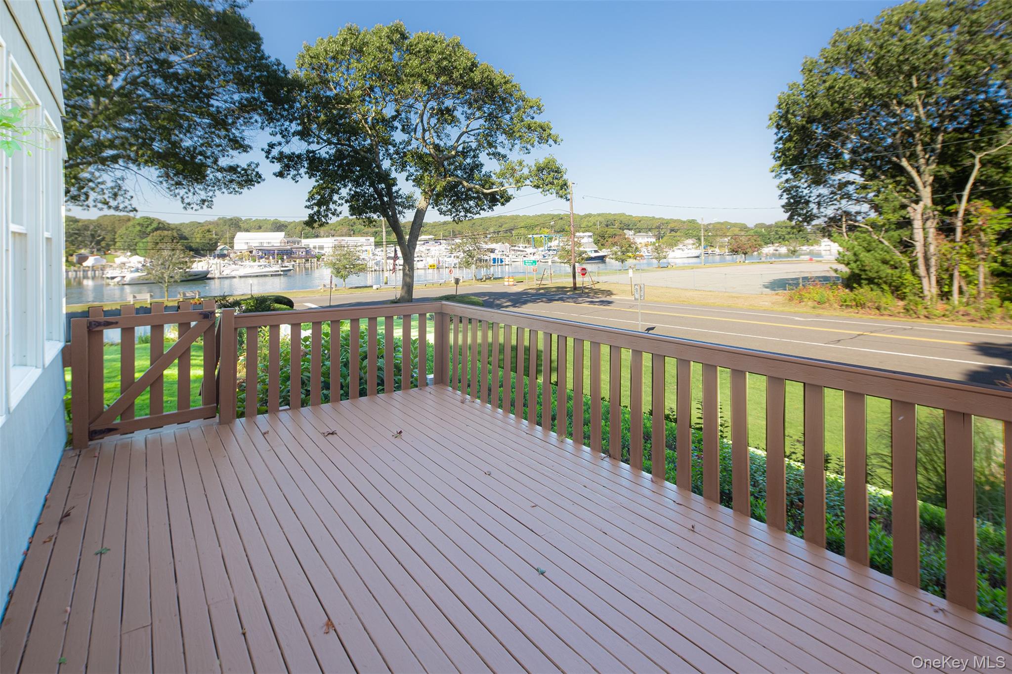 1 Canal Road Hampton Bays, NY 11946 - Photo 31 of 50 Deck featuring a yard and a water view