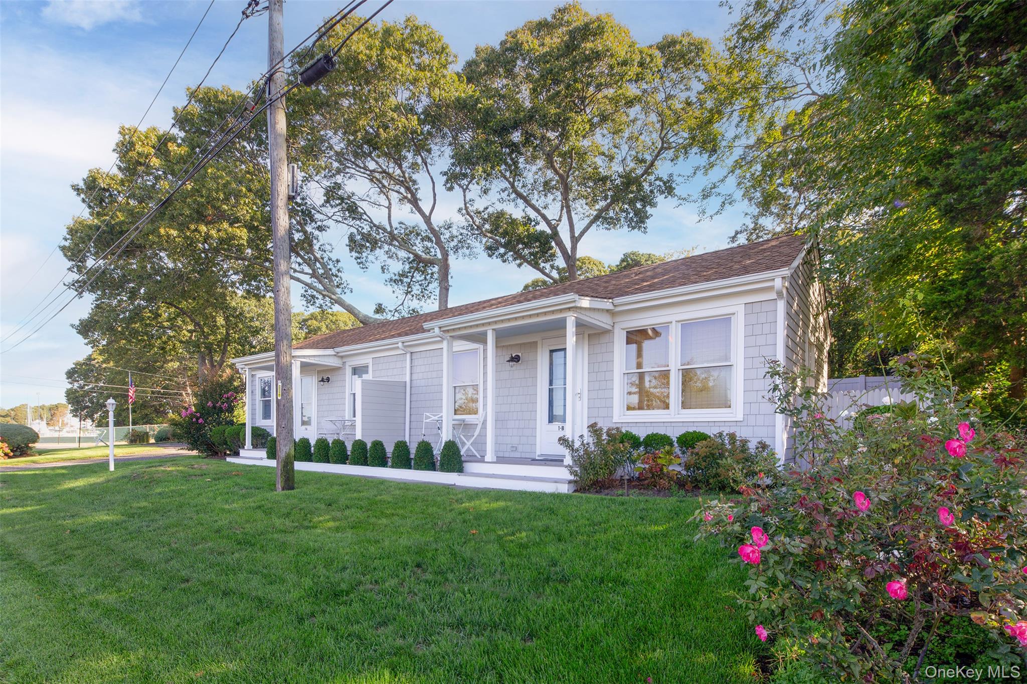 1 Canal Road Hampton Bays, NY 11946 - Photo 34 of 50 Bungalow-style home featuring covered porch and a shingled roof