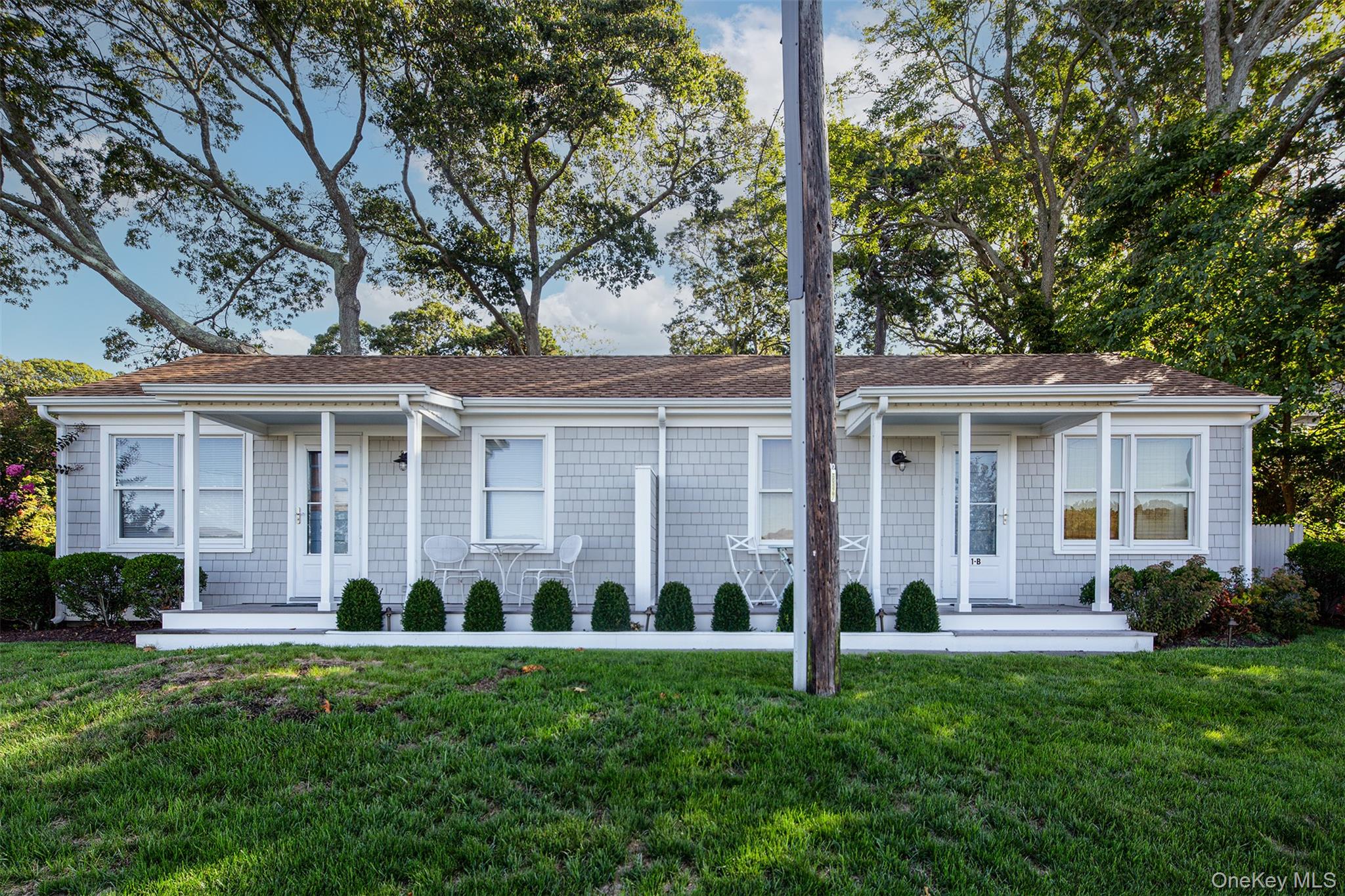 1 Canal Road Hampton Bays, NY 11946 - Photo 35 of 50 Single story home featuring a front lawn and a shingled roof
