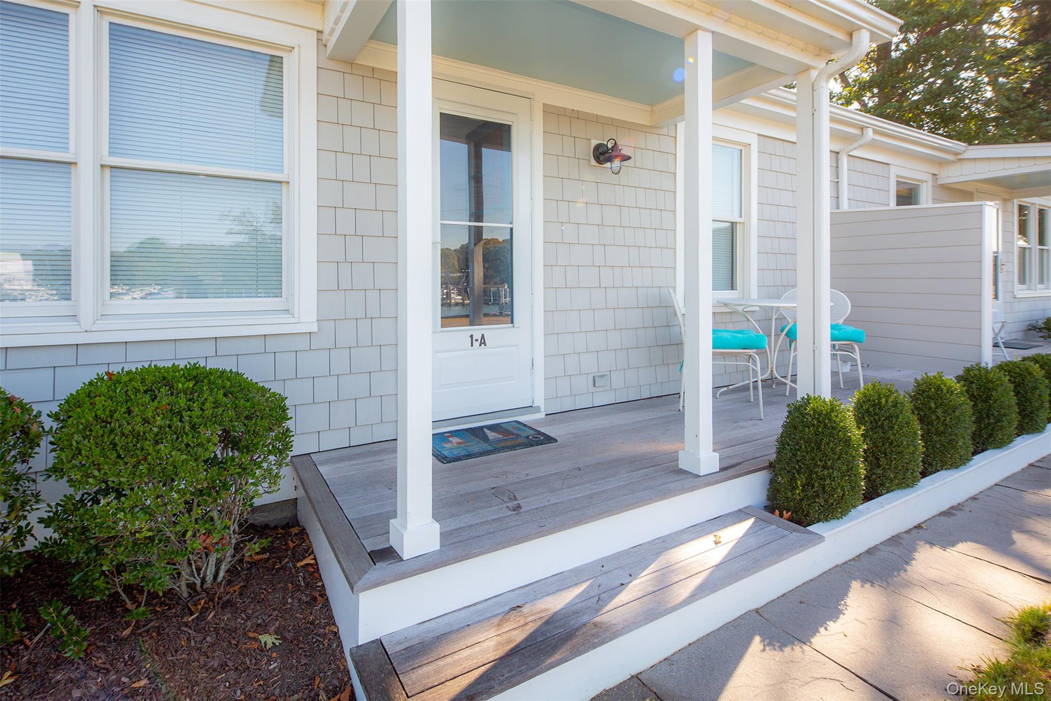 1 Canal Road Hampton Bays, NY 11946 - Photo 37 of 50 Doorway to property featuring covered porch