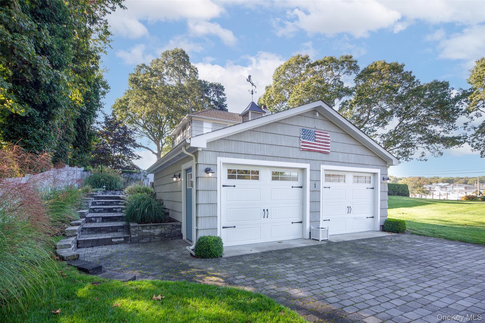 1 Canal Road Hampton Bays, NY 11946 - Photo 4 of 50 Garage with decorative driveway