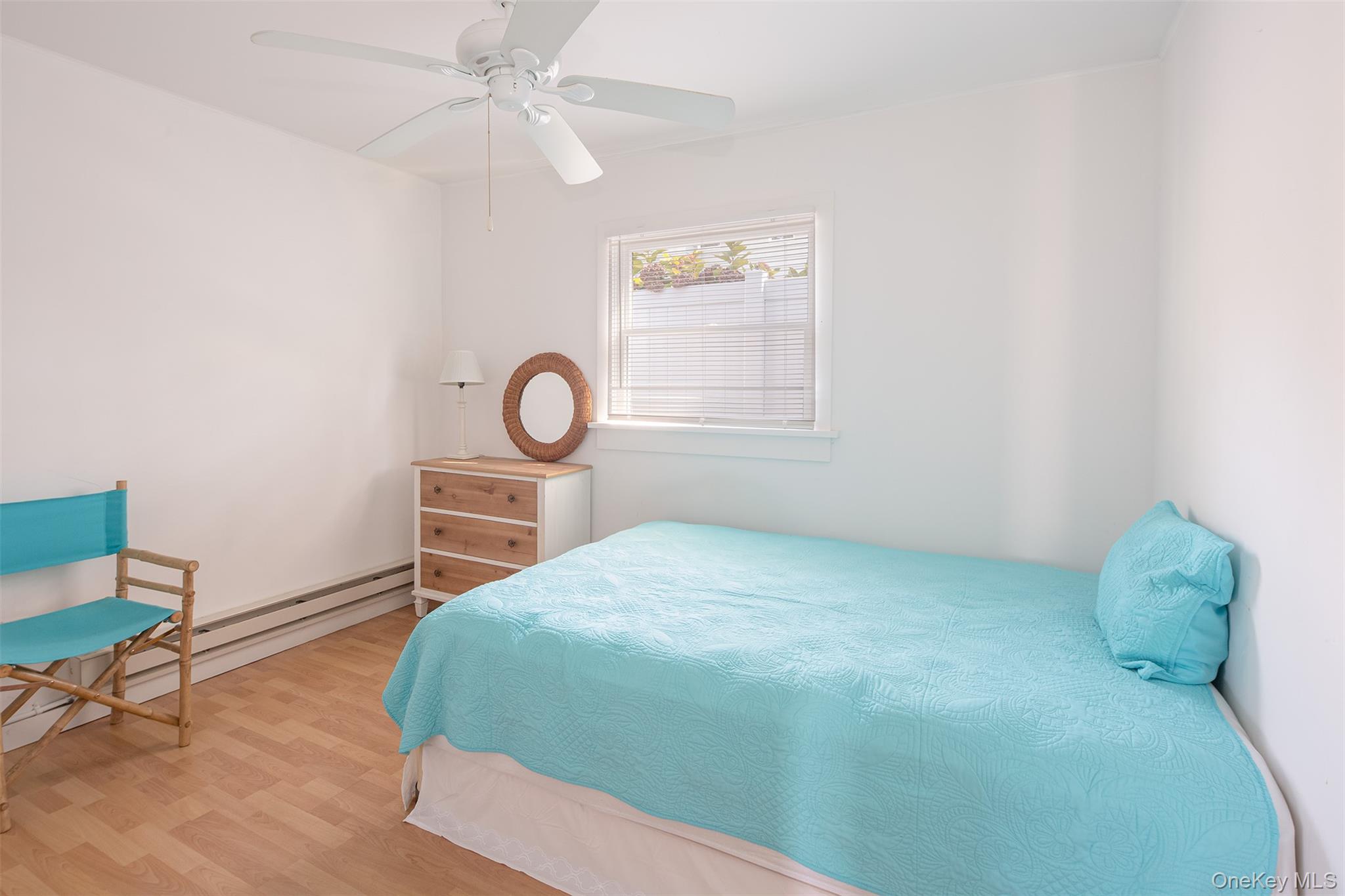 1 Canal Road Hampton Bays, NY 11946 - Photo 41 of 50 Bedroom featuring wood finished floors and a ceiling fan