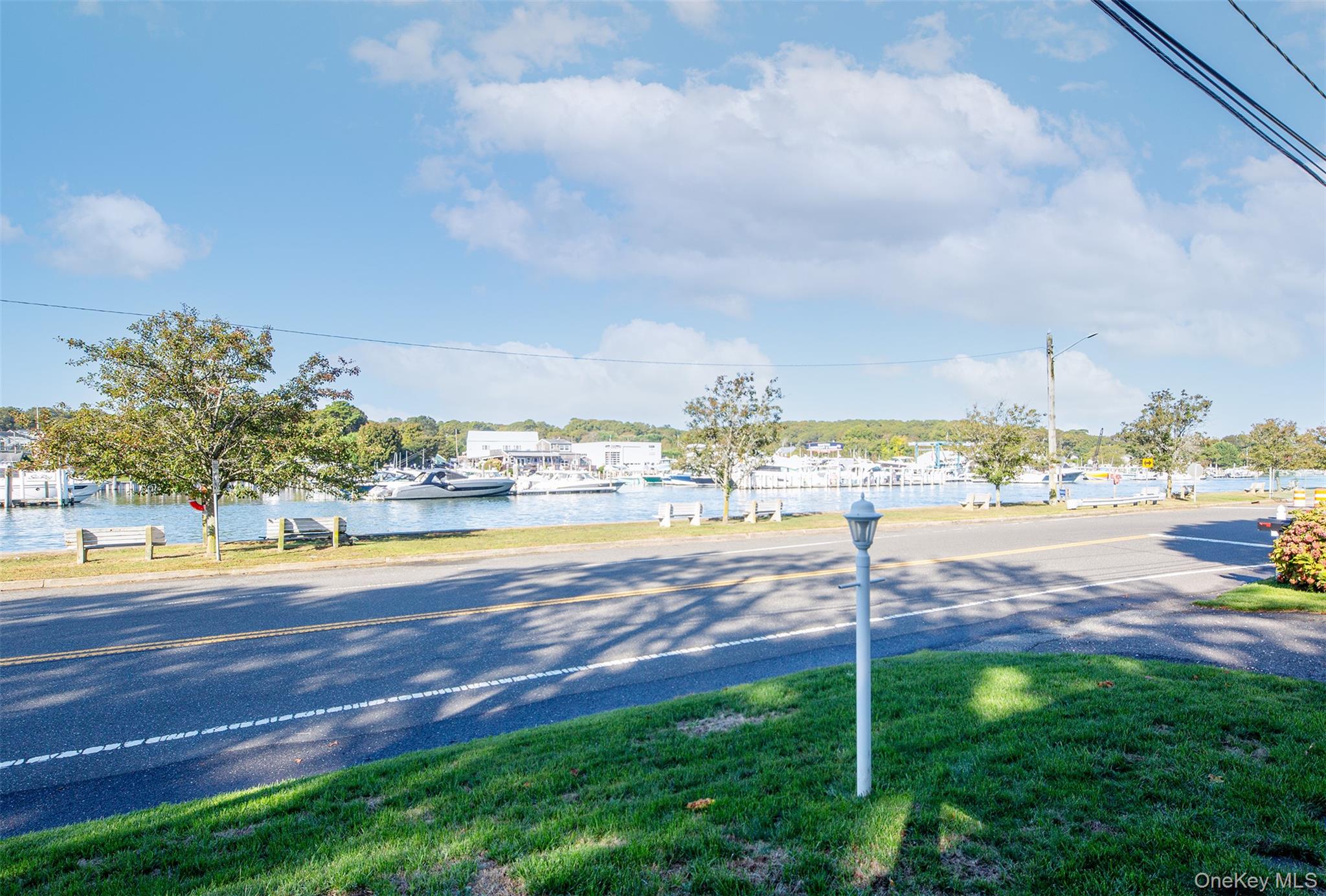 1 Canal Road Hampton Bays, NY 11946 - Photo 6 of 50 View of asphalt street with street lighting and a water view