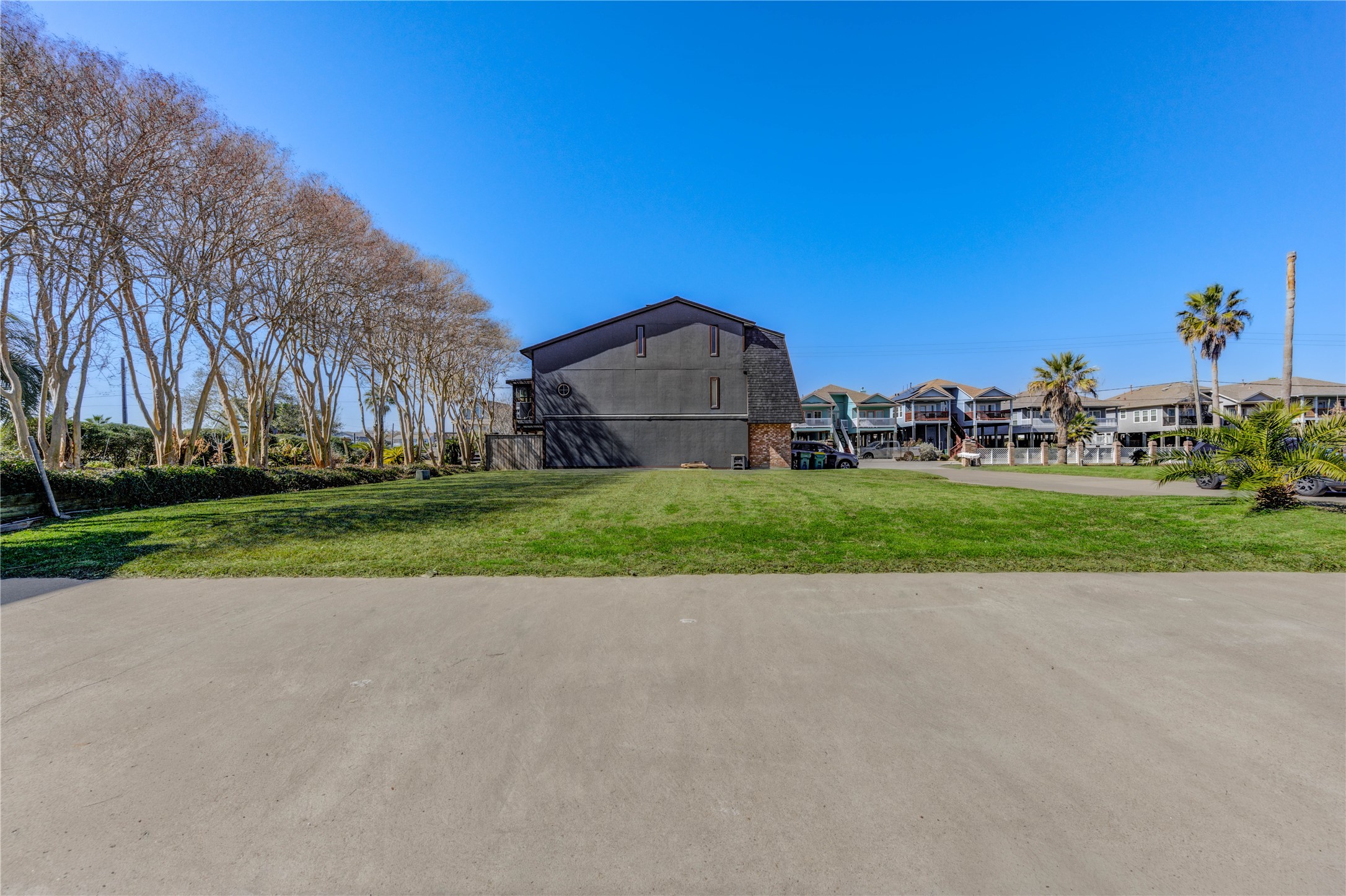 2102 Todville Road Seabrook, TX 77586 - Photo 5 of 19 One side of the property is lined with beautiful, mature, well-maintained trees, creating a natural backdrop that adds privacy, character, and a peaceful coastal feel.