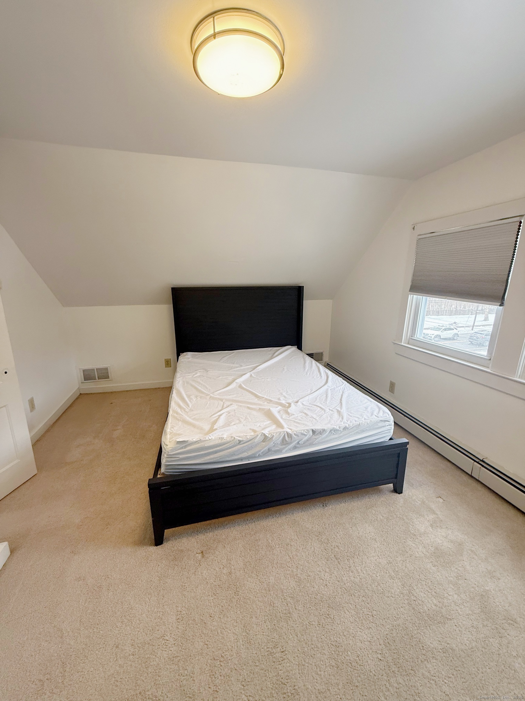 1716 Farmington Avenue Farmington, CT 06085 - Photo 15 of 22 a bedroom with a bed and dresser