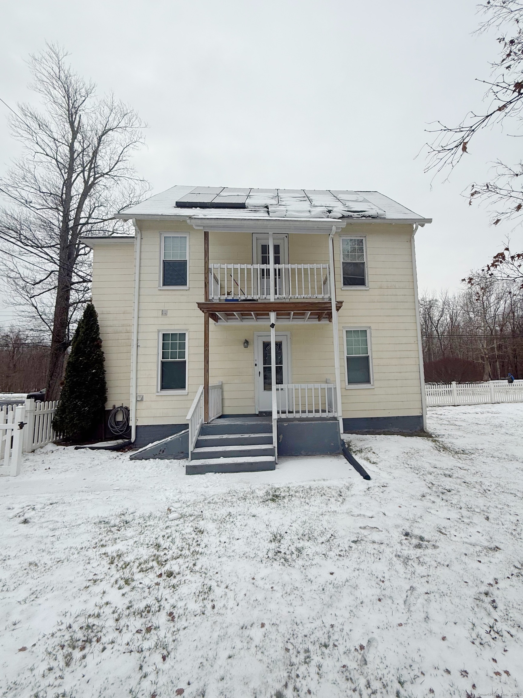 1716 Farmington Avenue Farmington, CT 06085 - Photo 20 of 22 a view of a house with a snow in the yard
