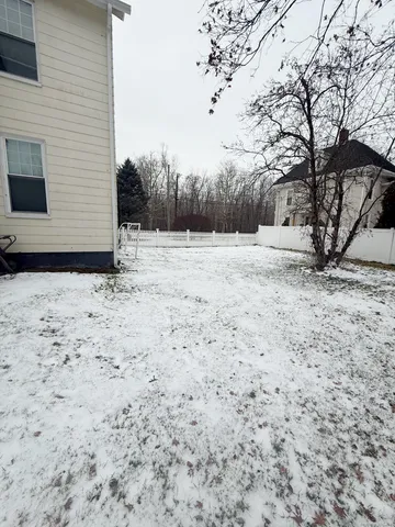 a view of snow on the side of the road
