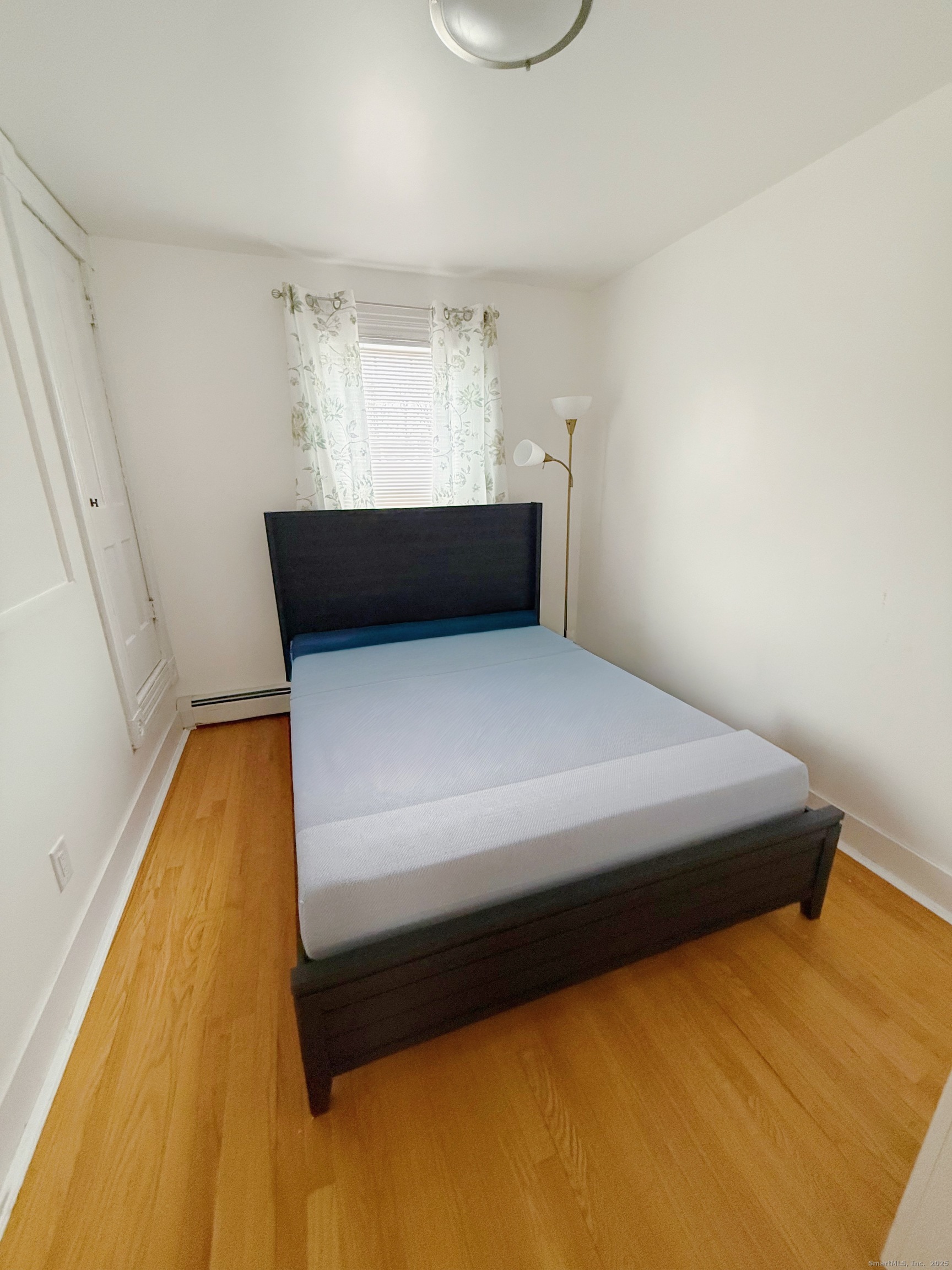 1716 Farmington Avenue Farmington, CT 06085 - Photo 4 of 22 a bedroom with a bed and window