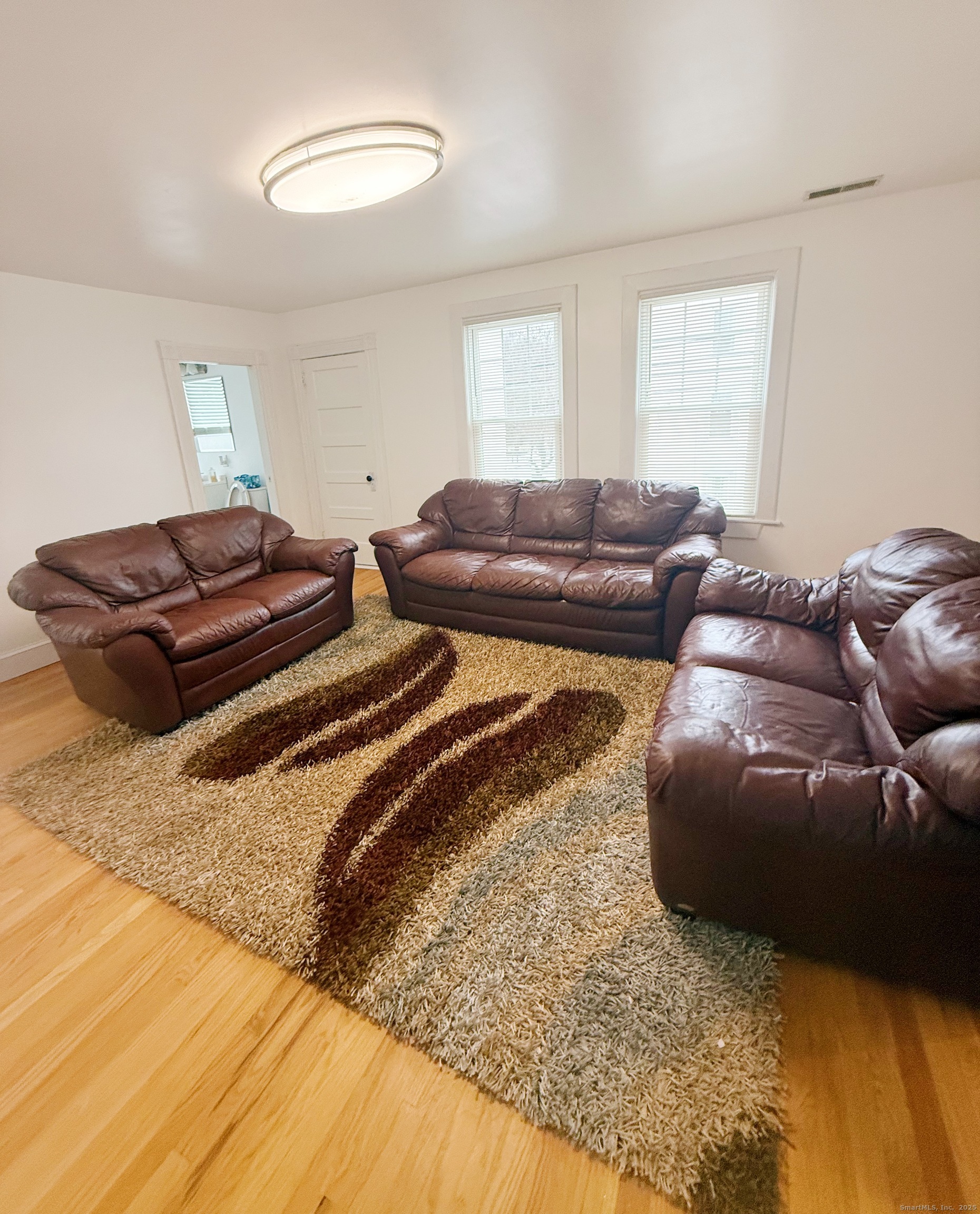 1716 Farmington Avenue Farmington, CT 06085 - Photo 6 of 22 a bedroom with a bed and a couch